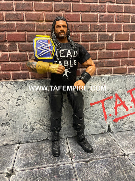 Roman Reigns elite head of the table with belt